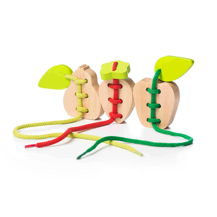 The Cubika Wooden Lacing Toy Set Fruits by Cubika features three fruit-shaped wooden toys with green leaf tops and colorful laces. This educational toy helps develop fine motor skills in a fun, hands-on way.