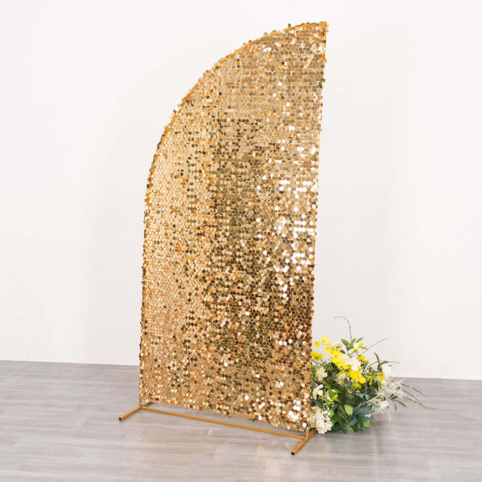 Gold sequin backdrop with floral arrangement for events or photo shoots.