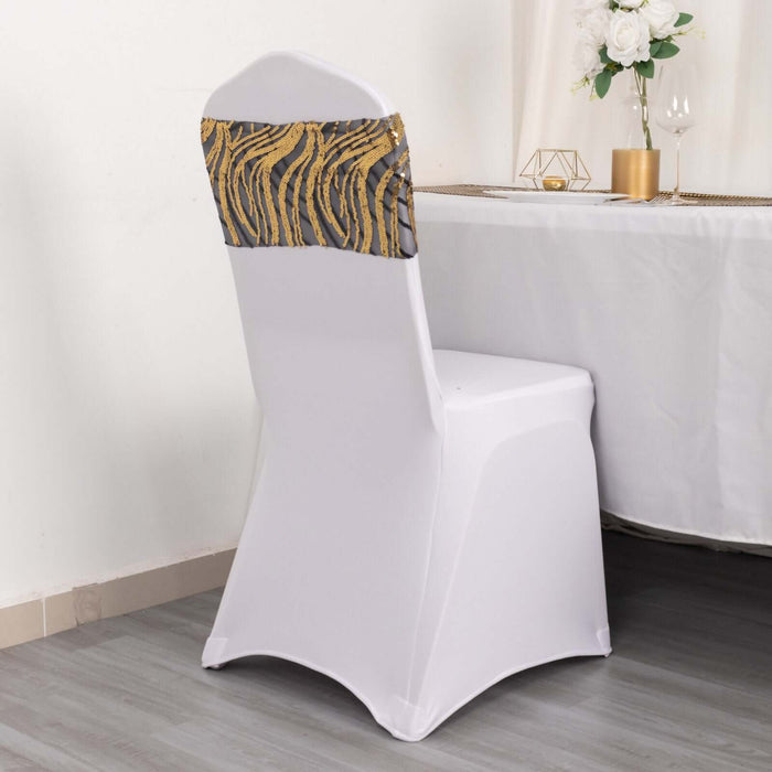 Elegant white chair cover with decorative gold and gray accents.
