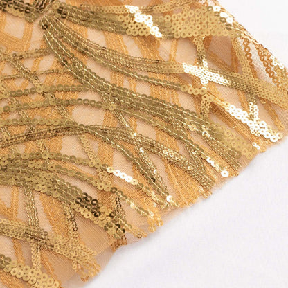 Gold sequin fabric with shimmering fringe details.