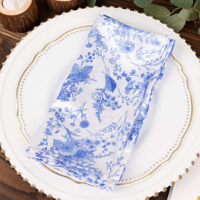 Blue floral patterned scarf on a decorative plate.