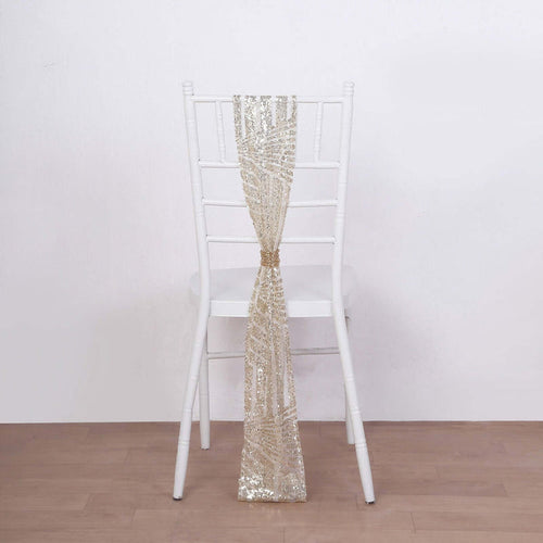 Gold sequin chair sash draped on a white chiavari chair.