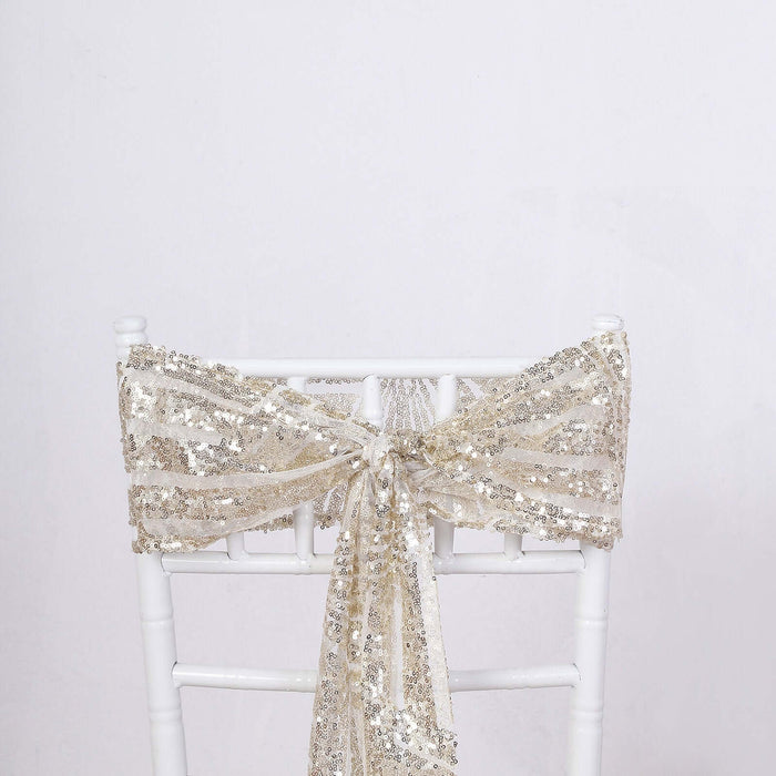 Gold sequin chair sash tied in a bow on a white chair