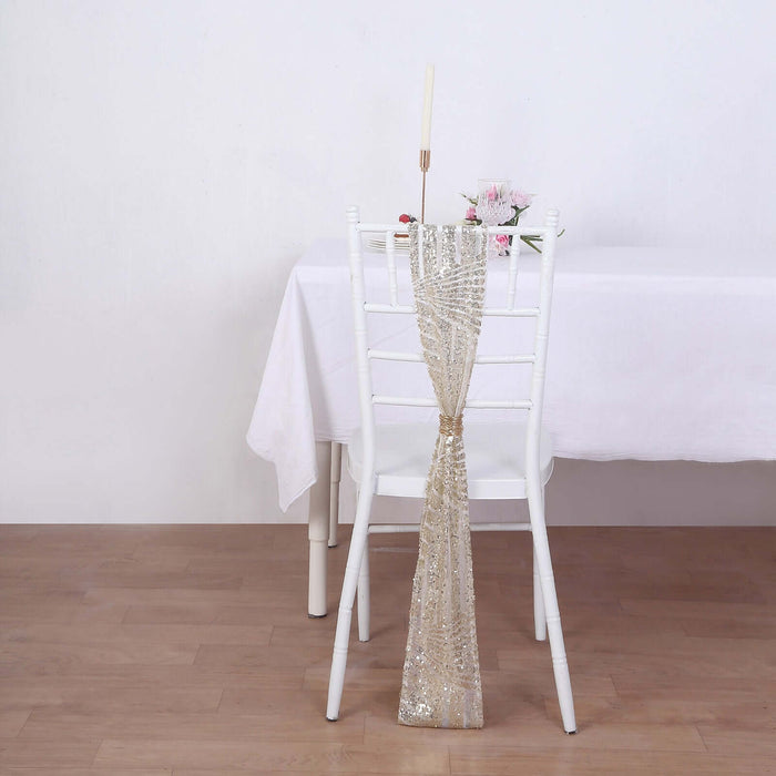 Elegant gold sequin chair sash draped on a white chair.