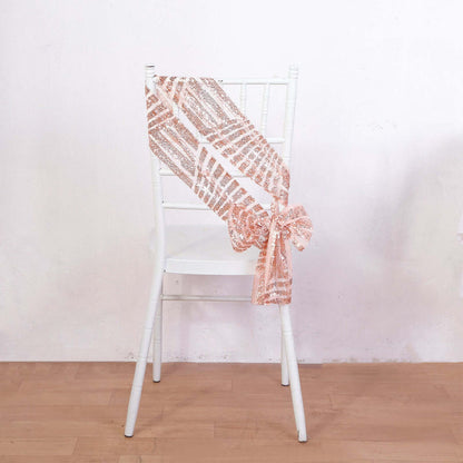 Rose gold sequin chair sash tied on a white chair.