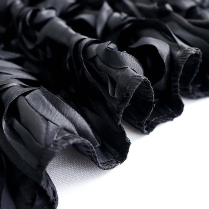 Black satin fabric with textured ruffles and smooth finish.