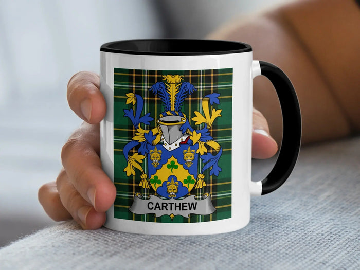 Carthew Irish surname mug with family crest on an Irish National Tartan background.