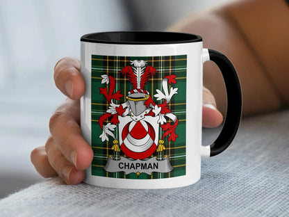 Chapman Irish surname mug with family crest on an Irish National Tartan background.