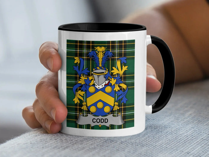Codd Irish surname mug with family crest on an Irish National Tartan background.