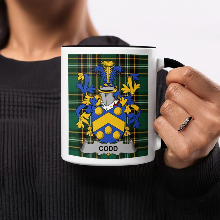 Codd heritage mug featuring the family crest, black handle and tartan design.