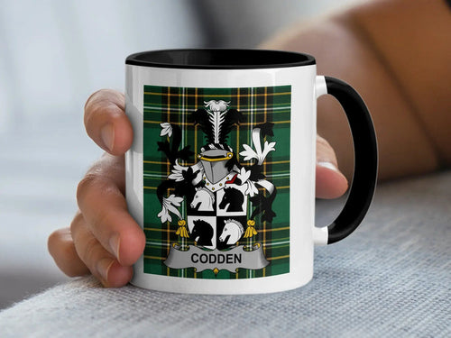 Codden Irish surname accent mug with black handle and surname emblem on Irish National Tartan