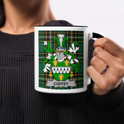 Coffey heritage mug featuring the family crest, black handle and tartan design.