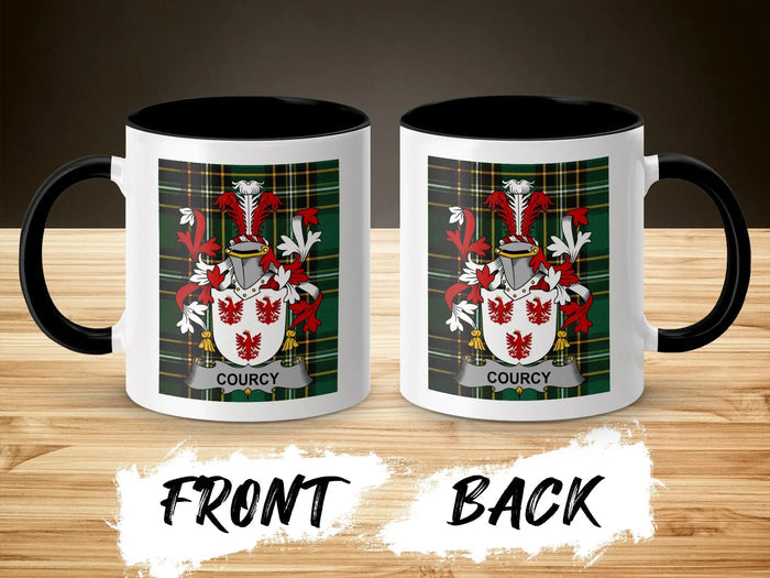 White mug with black rim and handle, featuring Courcy coat of arms.