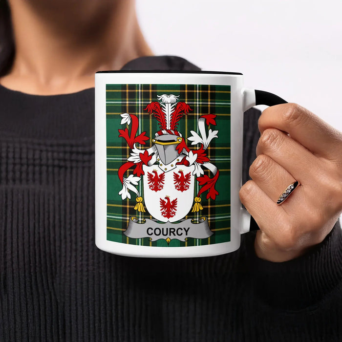 Mug featuring the Courcy family crest on a tartan background.