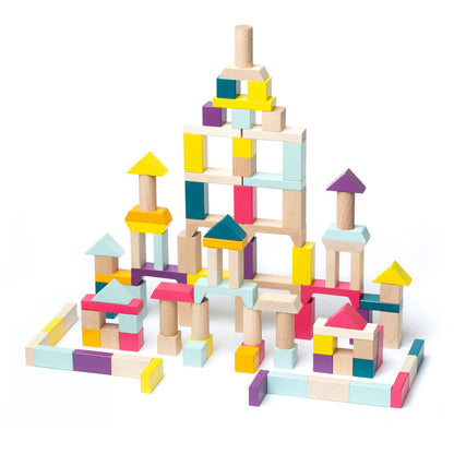 Cubika Wooden Blocks Construction Kit by Cubika features colorful, eco-friendly wooden blocks in rectangles, cylinders, and triangles, stacked to form a large intricate structure on a white background.