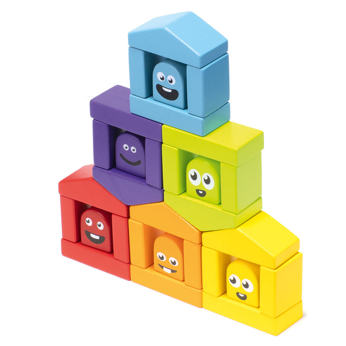 The Cubika Wooden Construction Set Colorful Houses by Cubika features vibrant, organic Carpathian wood blocks in red, orange, yellow, green, blue, and purple—perfect for stacking into playful pyramids with cheerful house designs.