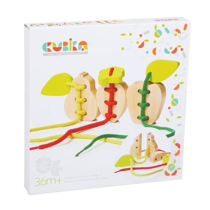 A box featuring the Cubika Wooden Lacing Toy Set Fruits, a wooden apple-shaped lacing toy with colored strings and green leaf pieces, designed to develop fine motor skills for children aged 36+ months. The brand name Cubika appears on top.