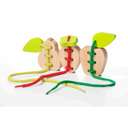 The Cubika Wooden Lacing Toy Set Fruits by Cubika features three apple-shaped wooden toys with green leaves and red, yellow, and green laces—an engaging educational toy that develops children's fine motor skills.
