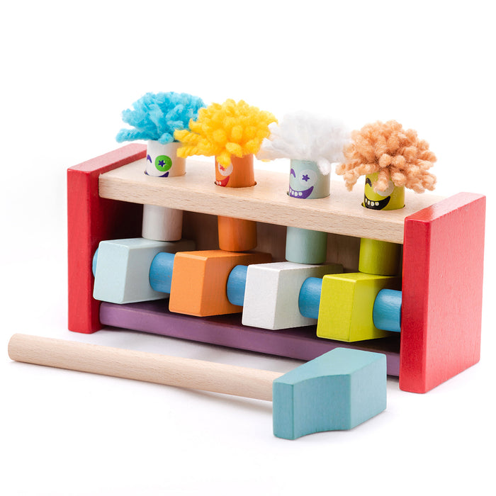 The Cubika Wooden Toy Jumping Clowns by Cubika is an eco-friendly toy with four wooden clowns, yarn hair, painted faces, a hammer, and a rainbow bench—ideal for pounding play and developing motor skills.