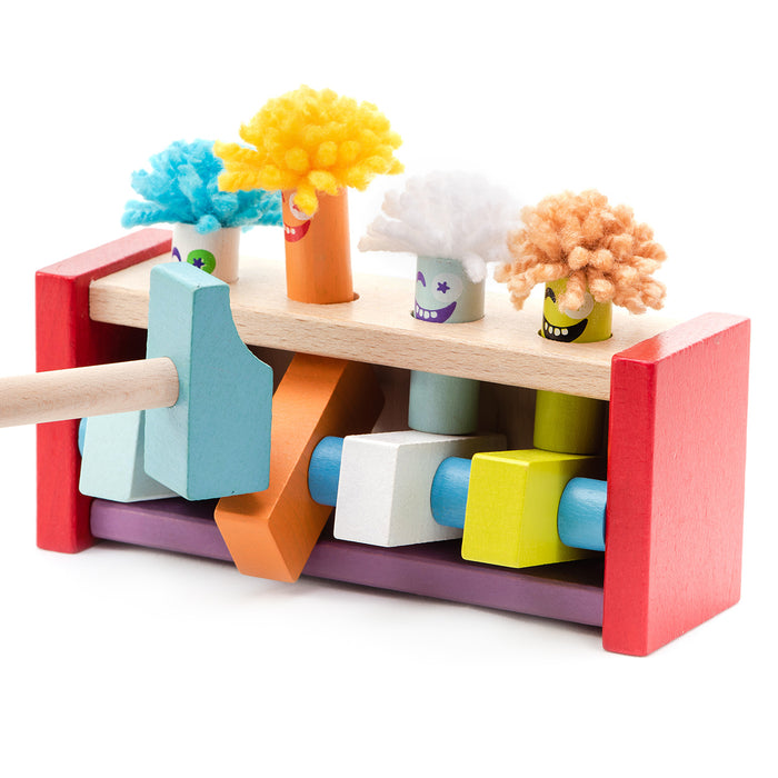 The Cubika Wooden Toy Jumping Clowns by Cubika is a colorful, eco-friendly set with wooden clowns in a red frame. Strike pegs with the mallet to make the playful figures pop up, boosting motor skills and fun.