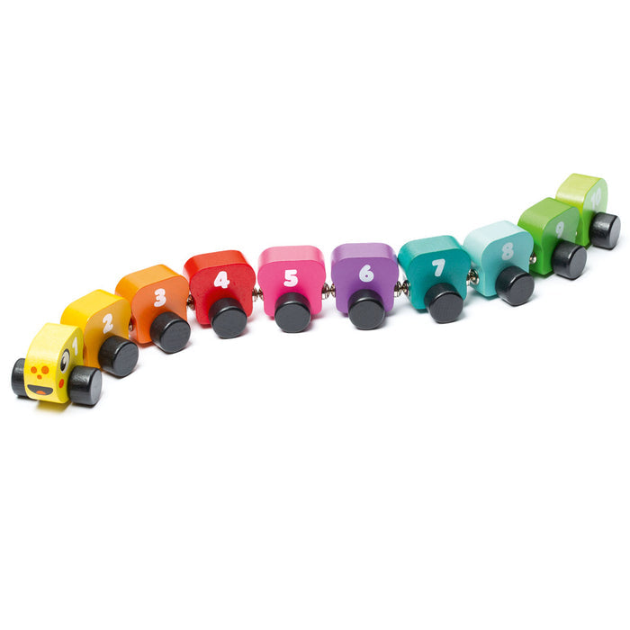 The Cubika Wooden Toy Rainbow Caterpillar by Cubika features ten organic wood cars, numbered 1-10 in vibrant colors, connected in a curved line. The first car has a smiling face for added charm.