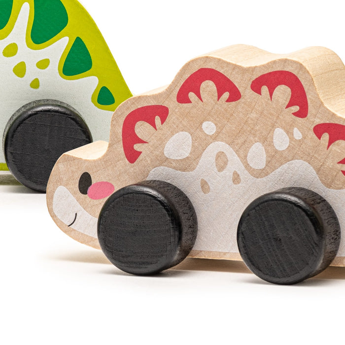 The Cubika Wooden Toy Set Joyful Dinos by Cubika features two organic wooden dinosaur toys with wheels, one in green and white and the other in natural wood with red and white patterns, displayed side by side on a white background.