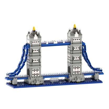 The Brixies Large Gift Box Tower Bridge is a micro-brick construction kit featuring gray, blue, and white blocks with two tall towers and blue suspension cables, capturing the charm of this iconic landmark.