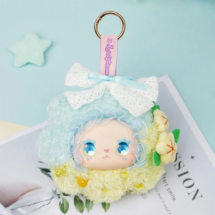 Lovely EMMA Floral Seasons Series plush keychain featuring a doll's head with starry eyes, pastel accents, and floral details. Preorder for November 2025 release.