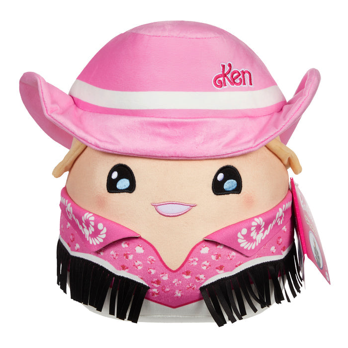 The Mattel Barbie Cutopia 10in Plush by Mattel is a kawaii plush toy with a smiling face, rosy cheeks, shiny eyes, a pink cowboy hat labeled Ken, and a pink bandana—perfect for Barbie fans.