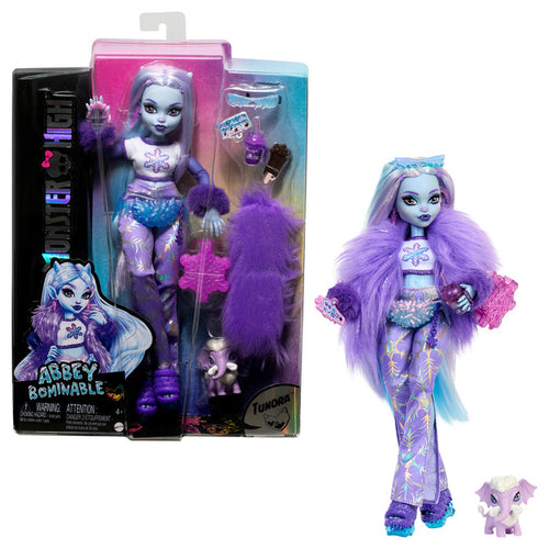 The Mattel Monster High Abbey Doll by Mattel features light blue skin, a purple furry jacket, stylish boots, signature long hair, and comes with a pet wooly mammoth. Shown packaged and posed with accessories.