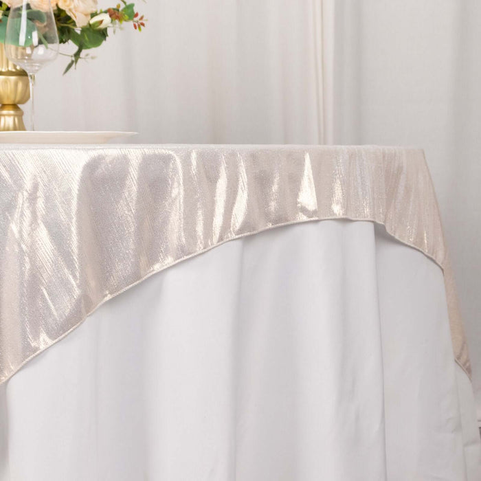 Elegant cream tablecloth draped over a white table for a sophisticated dining setting.