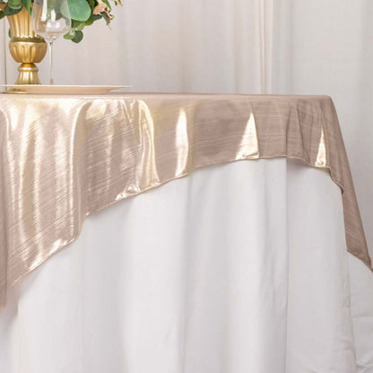 Elegant gold table runner draping over a white tablecloth.