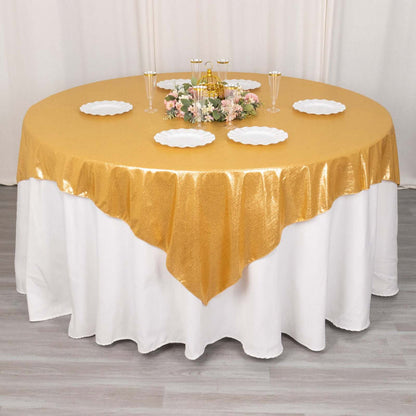 Round gold tablecloth draped elegantly over a white table.