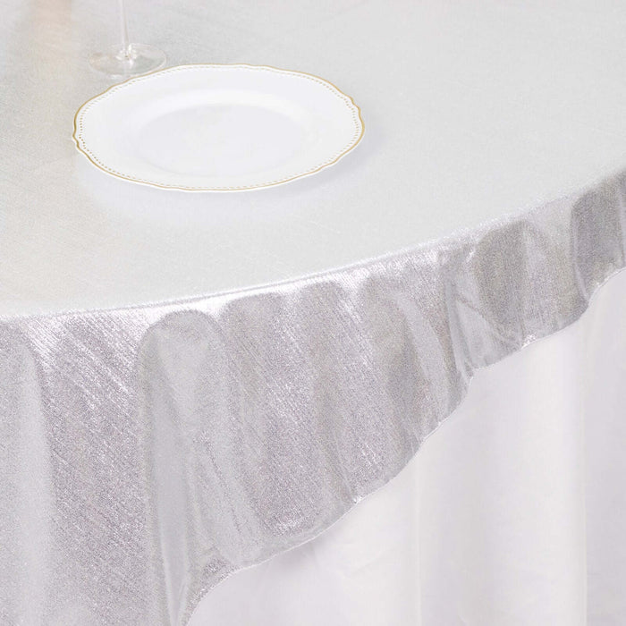 Silver tablecloth draping elegantly over a table.