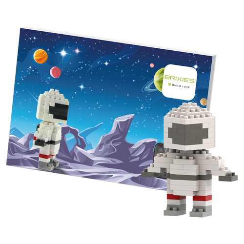 The Brixies Postcard Astronaut features a block-style astronaut figure built from micro bricks, posed before a vibrant space background with planets and stars, beside a “Brixies Build Love” sign.
