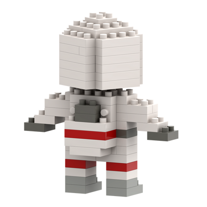 The Brixies Postcard Astronaut is a micro brick figure, mostly white with gray hands, boots, and backpack, plus red leg stripes, shown against a plain white background.