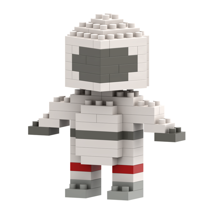 The Brixies Postcard Astronaut is a small, blocky figure made of white, gray, and red micro bricks, resembling a stylized astronaut with a square head and simple features.