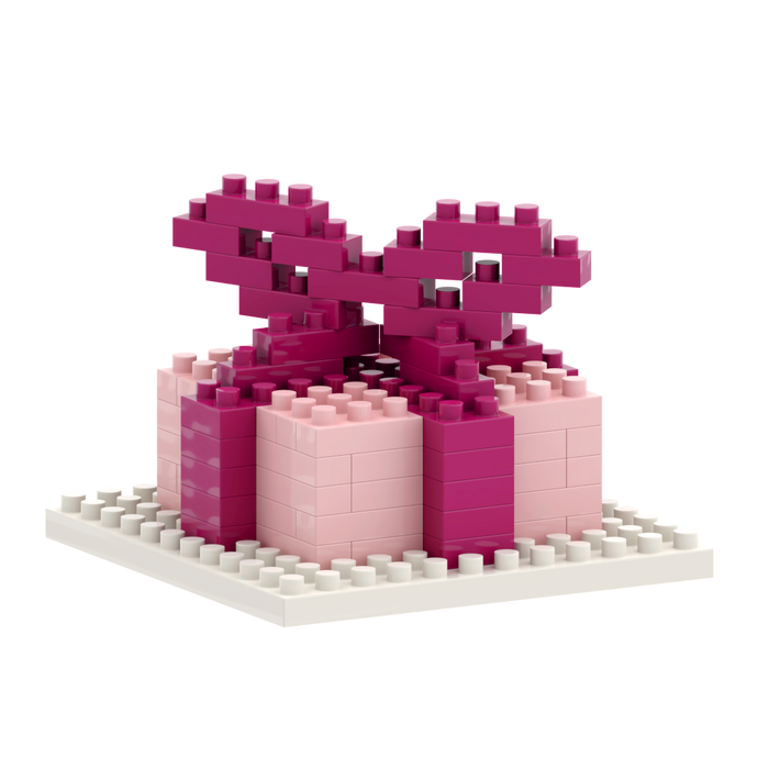 The Brixies Postcard Gift is a small 3D gift box model in pink and magenta micro bricks on a white base, with a large brick bow on top—an adorable addition to any Brixies Post Card collection.