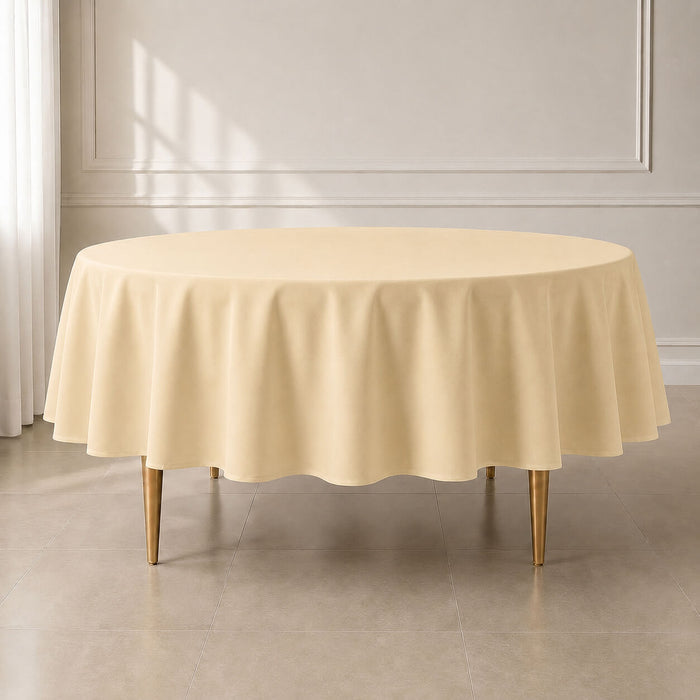 beige round tablecloth on a wooden table