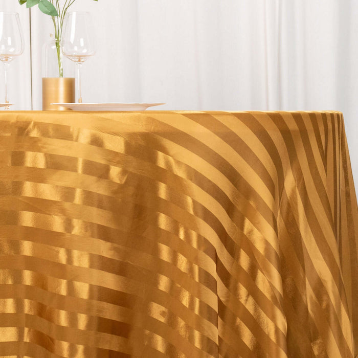 Gold striped tablecloth draped elegantly over a table.