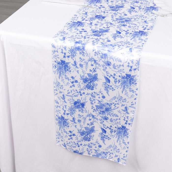Blue floral table runner on a white tablecloth