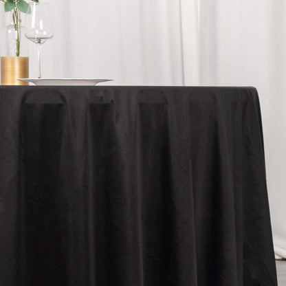 Black tablecloth draped elegantly on a table in a refined setting.