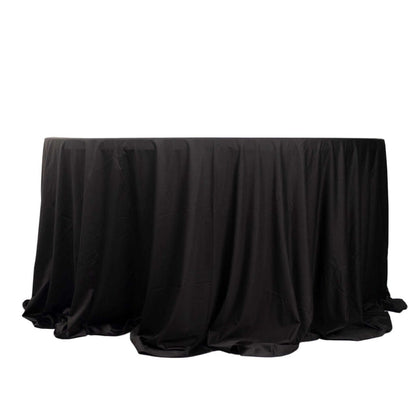 Black tablecloth draped elegantly over a round table.