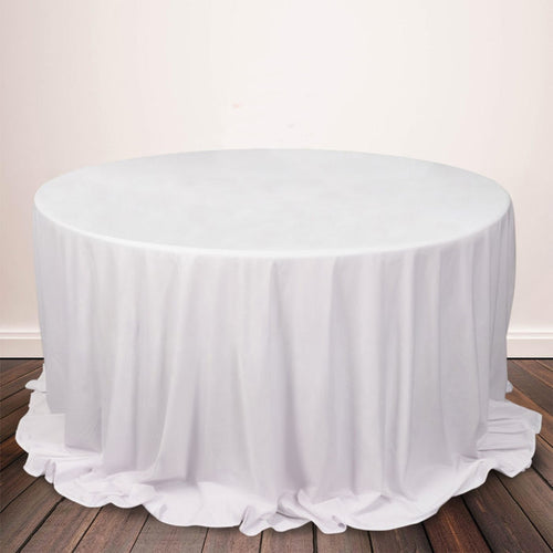 Round white tablecloth draped elegantly over a circular table