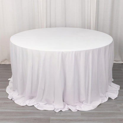 White round table with a draped tablecloth
