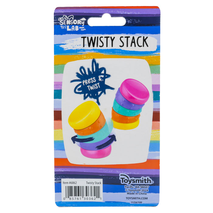 A vibrant Sensory Lab Twisty Stack package displays two stacked, multicolored sensory toys with "Press & Twist" instructions on a rainbow-striped background, highlighting motion play and Sensory Lab branding.