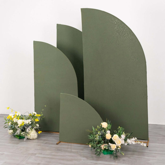 Green curved backdrops with floral arrangements in a studio setting.