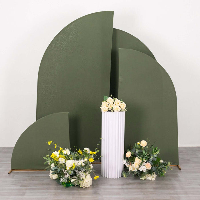 Green abstract backdrop with white pedestal and floral arrangements.