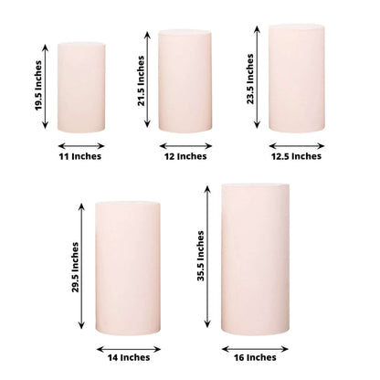Set of decorative candles in various heights and sizes on a white background.