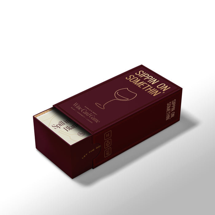 A maroon box labeled "Sippin on Somthin'" by Som Ventures features a wine glass graphic and elegant gold and white text. The partially open box reveals cards for a fun wine tasting and trivia card game experience.